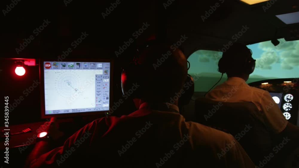MS PAN Instructor and pilots in professional flight simulator during flight MS PAN Instructor and pilots in professional flight simulator during flight