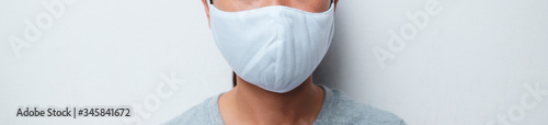 Close up woman portrait, Young woman wearing home made hygienic face medical mask to prevent infection, illness or flu and 2019-nCoV. white background. Protection against disease, coronavirus.