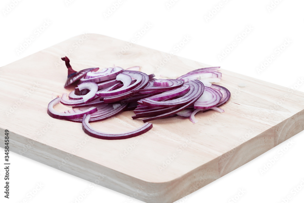 Purple onions cut on a wooden chopping board in the kitchen, ready to cook. Purple onions cut on a wooden chopping board in the kitchen, ready to cook.