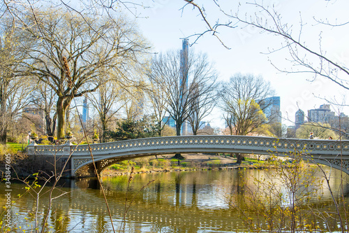 The Bow Bridge is a cast iron bridge located in Central Park  New York City  crossing over the Lake and used as a pedestrian walkway.