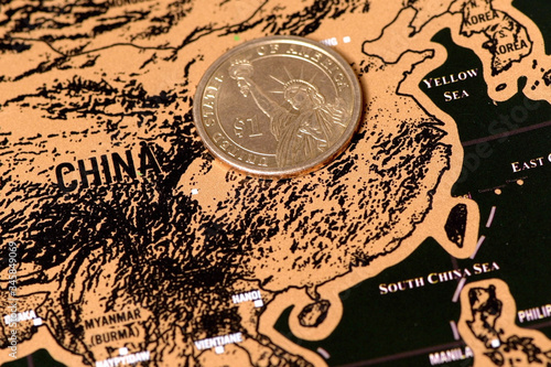 luxury travel scratch map of blogger with one dollar coin photo