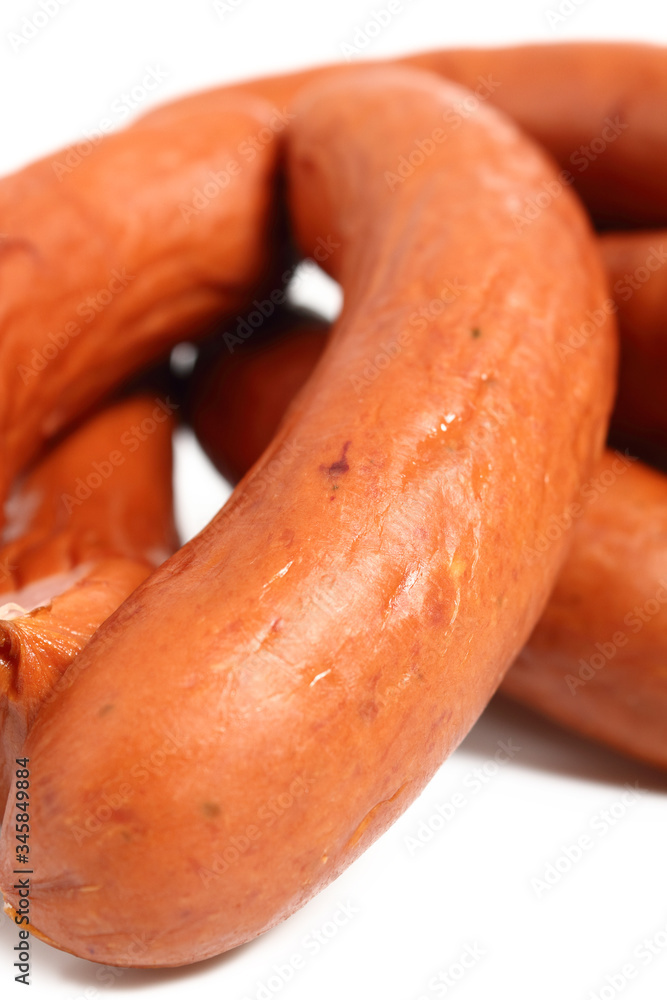 Smoked sausages isolated on a white background Smoked sausages isolated on a white background