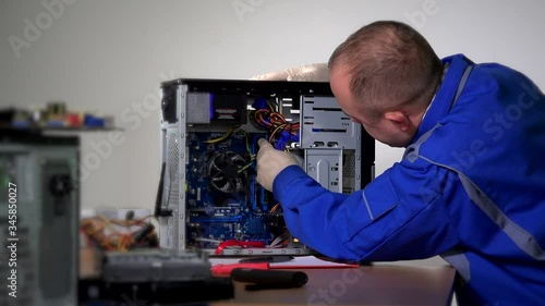 man worker in blue jacket check computer maintenance. 4K