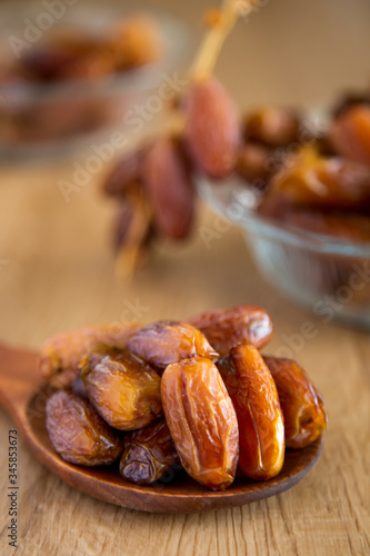 Kurma or dates on wooden background