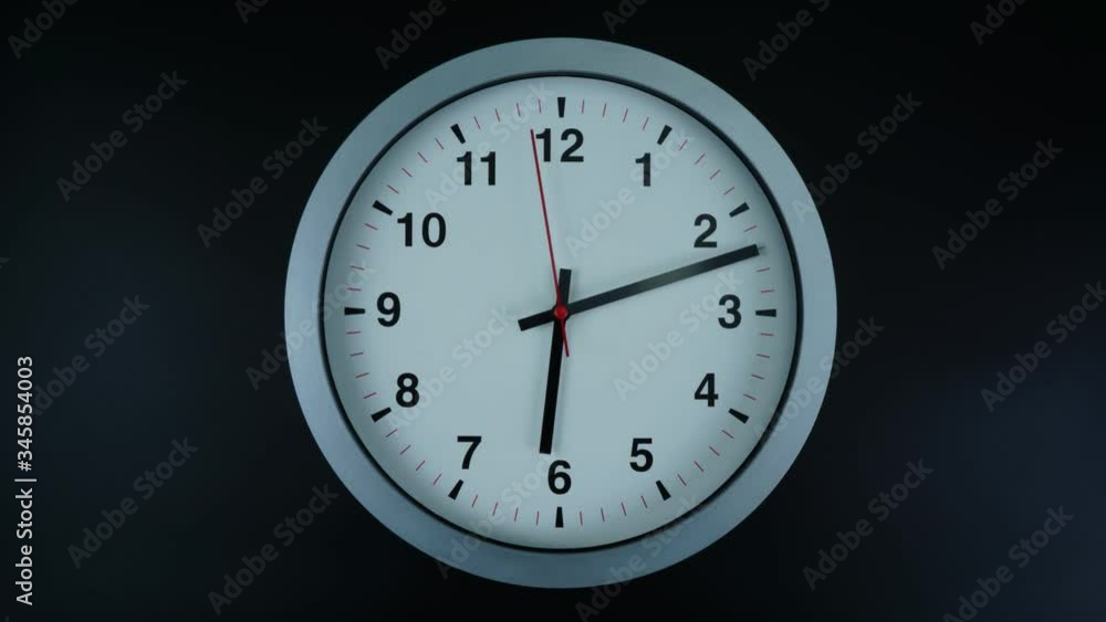 Gray wall clock isolated face beginning of time 06.00 am or pm. on black background, Time lapse 60 minutes moving fast, Time concept. Gray wall clock isolated face beginning of time 06.00 am or pm. on black background, Time lapse 60 minutes moving fast, Time concept.