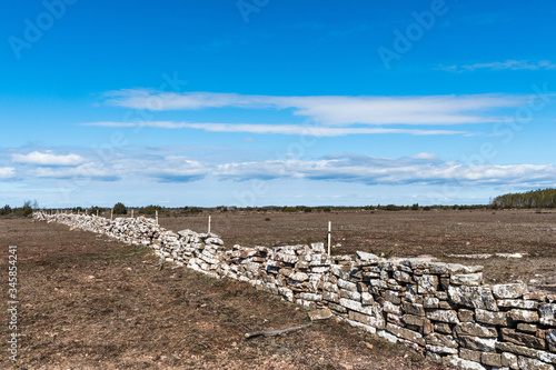 Boundry of a traditional dry stonewall in a great grassland photo