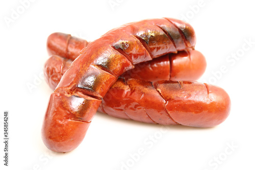 Grilled sausages isolated on a white background