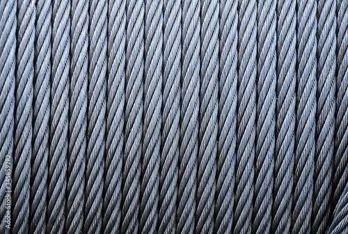 Coiled industrial cabling.Background of galvanized metal cable on the winch,Industrial wire roll background