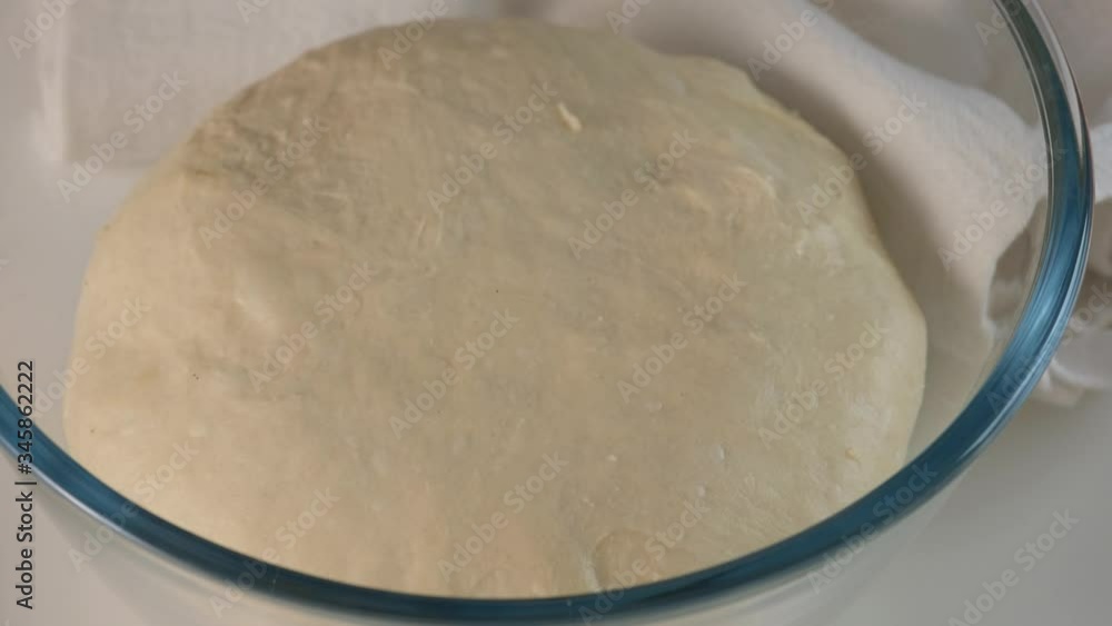 Yeast dough, flour. Female hands roll raw dough for Italian food Pizza roll stromboli with cheese, mozzarella, salami, tomatoes, spinach and red pepper. Yeast dough, flour. Female hands roll raw dough for Italian food Pizza roll stromboli with cheese, mozzarella, salami, tomatoes, spinach and red pepper.