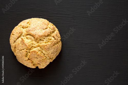 Homemade Irish Soda Bread on a black background, top view. Flat lay, overhead, from above. Copy space.