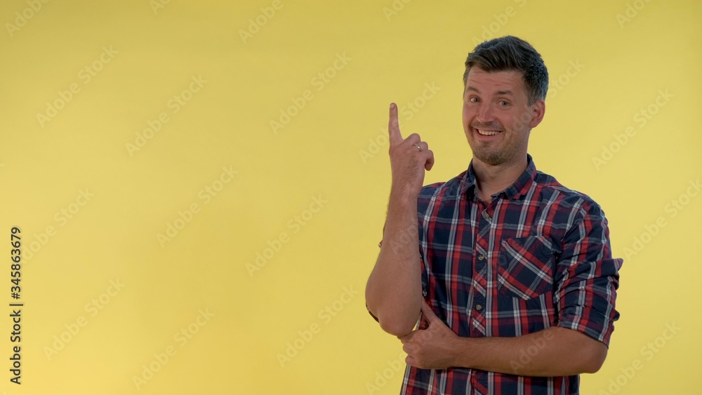 Cheerful young man finding an excellent solution of his problem. He is happy and showing thump up gesture. Cheerful young man finding an excellent solution of his problem. He is happy and showing thump up gesture.