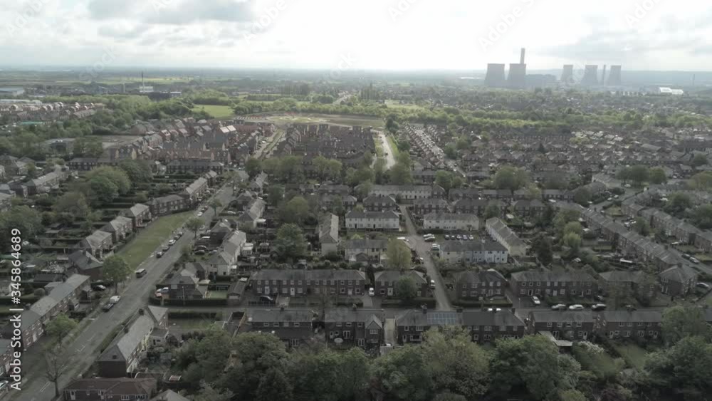 Drone aerial view overlooking British town houses gardens suburban residential overhead scene slow pull back Drone aerial view overlooking British town houses gardens suburban residential overhead scene slow pull back