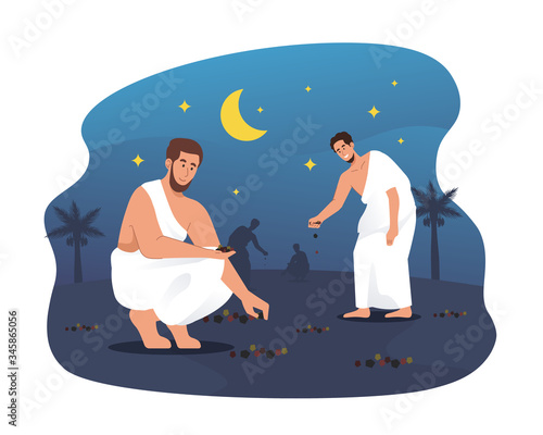 Hajj pilgrims collecting pebbles at Muzdalifah. Ritual of Hajj pilgrimage
