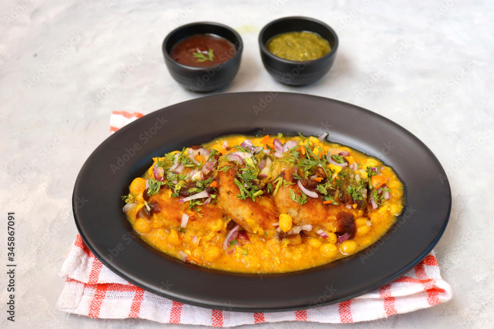 Indian Food-Ragda Pattice is popular street food of India. Ragada is a curry made of yellow vatana & pattice is made of potatoes along with spices. garnished with Sweet & mint chutney, chopped onions. Indian Food-Ragda Pattice is popular street food of India. Ragada is a curry made of yellow vatana & pattice is made of potatoes along with spices. garnished with Sweet & mint chutney, chopped onions.
