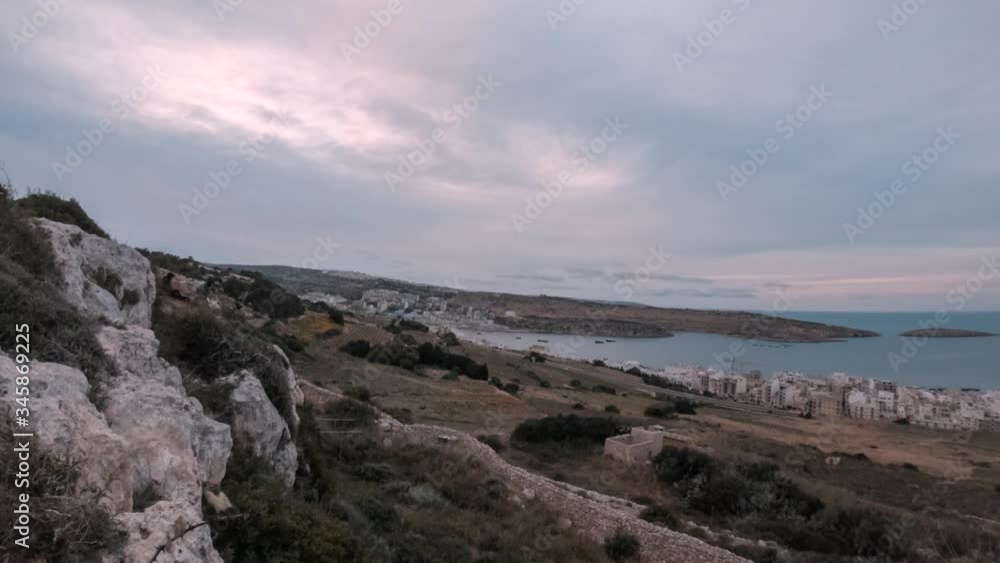 Beautiful Sunset With Colourful Sky In Malta, Over St Paul's Bay Islands From Wardija Beautiful Sunset With Colourful Sky In Malta, Over St Paul's Bay Islands From Wardija