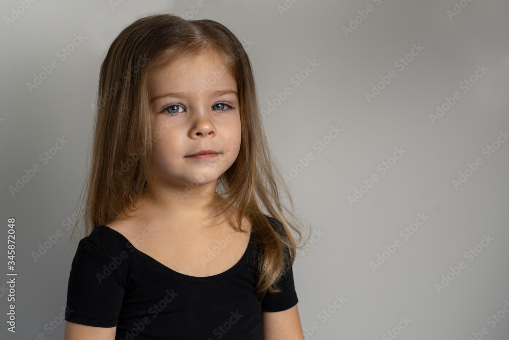 portrait of a beautiful little girl 3-4 years old. copy space to the right portrait of a beautiful little girl 3-4 years old. copy space to the right