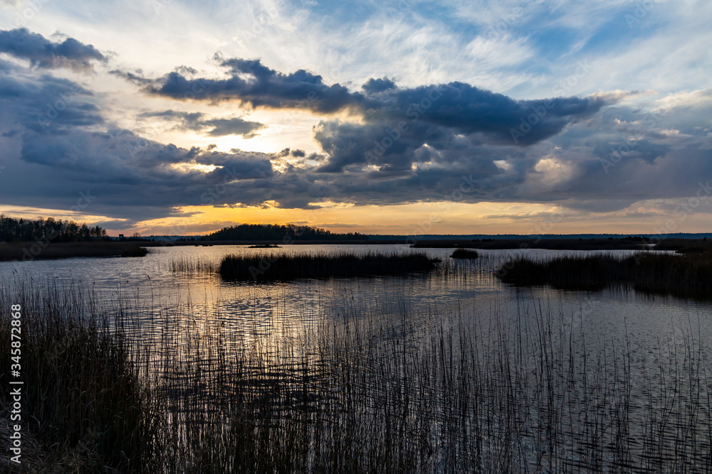 Fototapeta premium Sunset over Lake Kanieris in the spring evening.