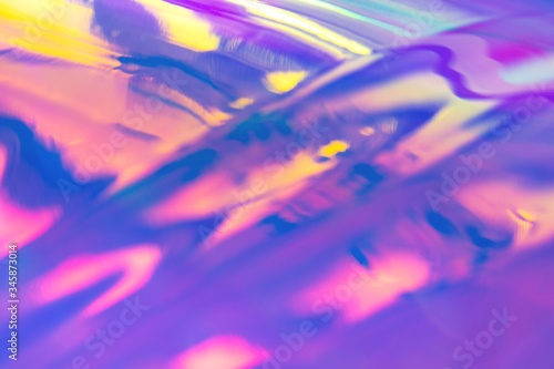 Blurred texture in violet, pink and mint colors. Abstract trendy holographic background in 80s style. Synthwave. Vaporwave style. Retrowave, retro futurism, webpunk photo