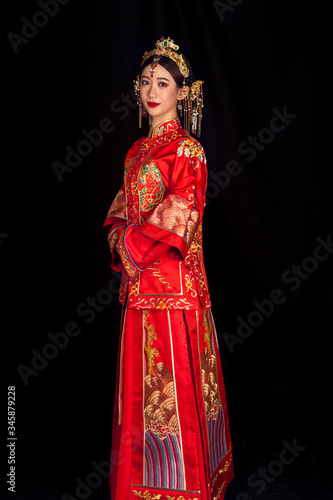 Portrait of wearing ancient Asian woman costume in black background