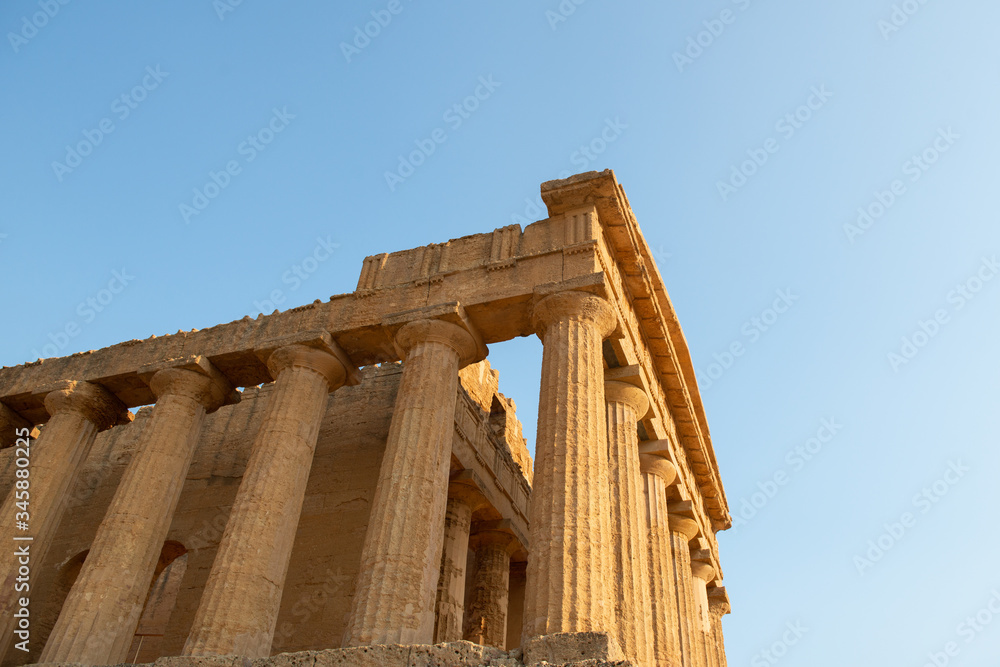 Valley of the Temples (Valle dei Templi), an ancient Greek Temple built in the 5th century BC, Agrigento, Sicily. Famous tourist attraction in Italy. Old marble columns of the Doric order. Valley of the Temples (Valle dei Templi), an ancient Greek Temple built in the 5th century BC, Agrigento, Sicily. Famous tourist attraction in Italy. Old marble columns of the Doric order.