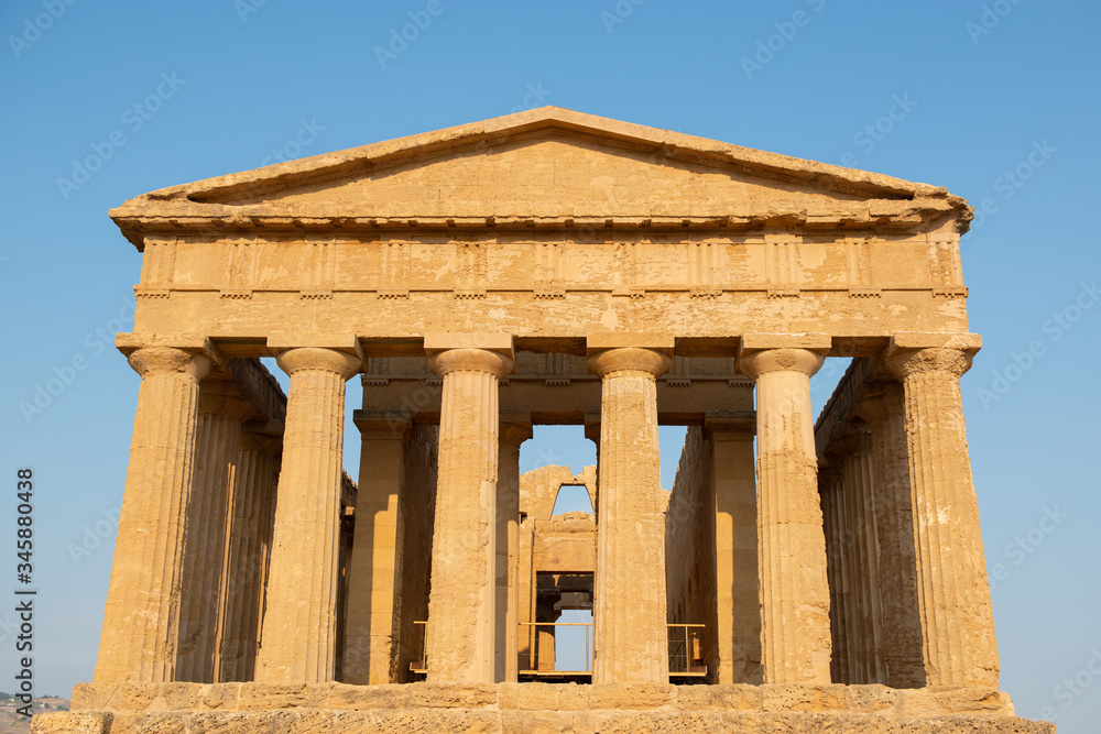 Valley of the Temples (Valle dei Templi), an ancient Greek Temple built in the 5th century BC, Agrigento, Sicily. Famous tourist attraction in Italy. Old marble columns of the Doric order Valley of the Temples (Valle dei Templi), an ancient Greek Temple built in the 5th century BC, Agrigento, Sicily. Famous tourist attraction in Italy. Old marble columns of the Doric order