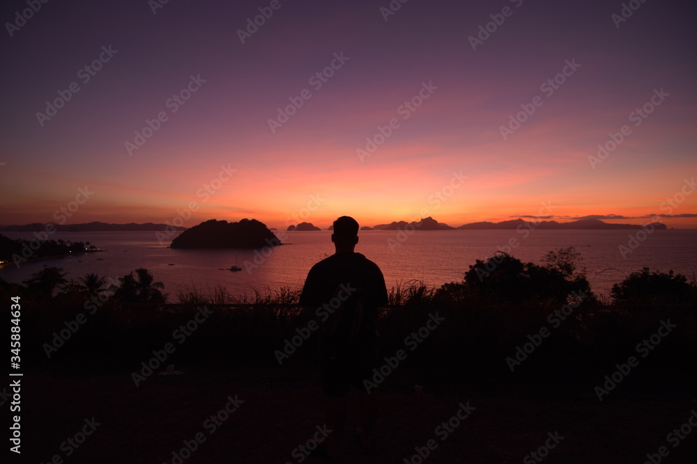 Silhouette of man at sunset in El Nido, Palawan, Philippines