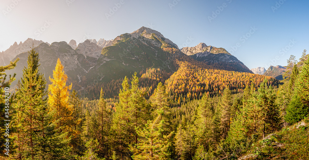 Panoramic view of magical nature in Dolomites at the national park Three Peaks (Tre Cime, Drei Zinnen) during sunset at direct light, South Tyrol, Italy