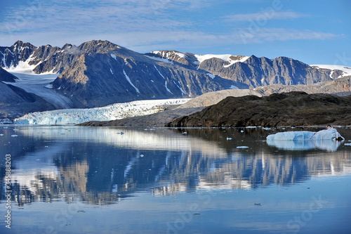 Blue ice drifting iceberg. Landscape of the Svalbard archipelago.