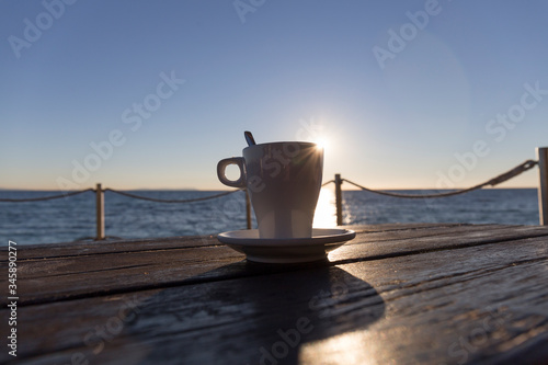 coffee at sunset on a terrace by the sea