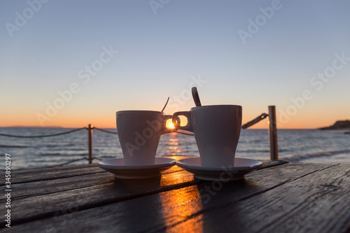 coffee at sunset on a terrace by the sea