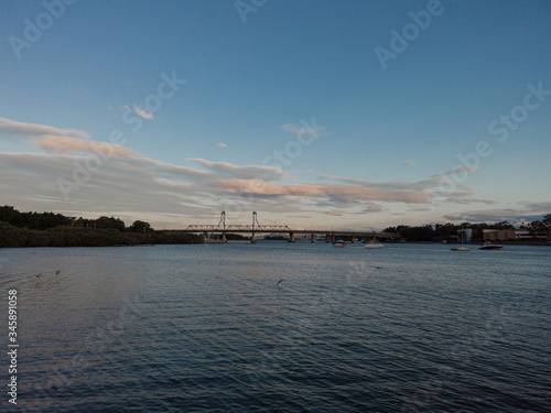 Sunset view at Parramatta River with Ryde Bridge on the distance. Sydney, Australia.