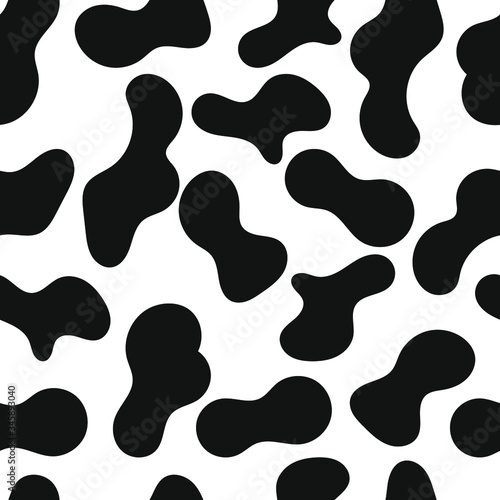 Seamless pattern black and white cow skin, animal print or dalmatian dog stains. Vector illustration. Colorful print can be used for textile, fabric, wrapping, wallpaper etc