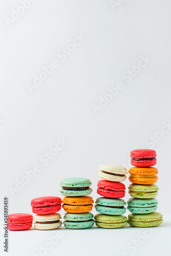 Beautiful colorful desserts. French macaroons on a white background 