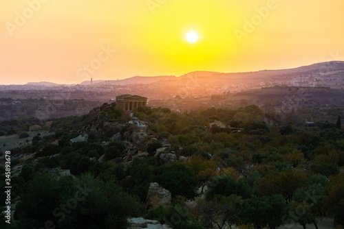 Sunset at Valley of the Temples (Valle dei Templi), ancient Greek Temple built in the 5th century BC, Agrigento, Sicily. Famous tourist attraction in Italy. Sicilian landscape, travel destination