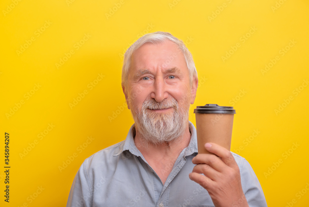 Senior man is giving coffe mug banner copy space. Seniors morning. Senior man is giving coffe mug banner copy space. Seniors morning.