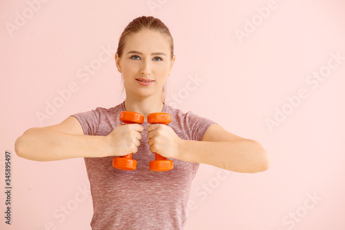Sporty young woman training...