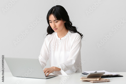 Beautiful Asian secretary a...