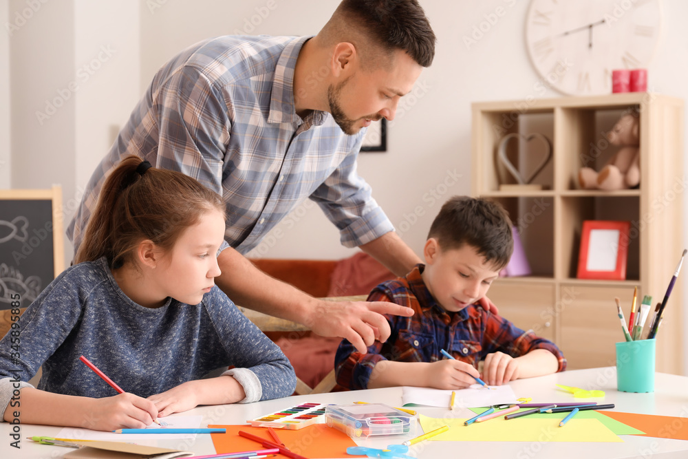 Fototapeta premium Drawing teacher giving private lessons at home