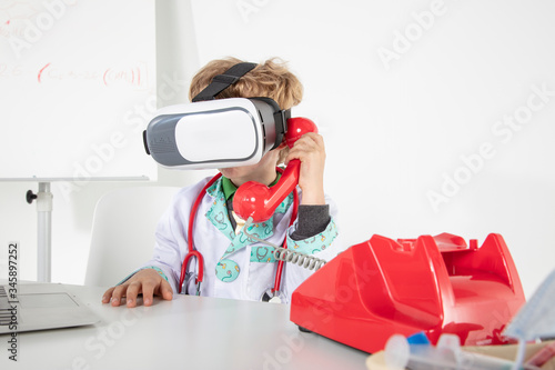 young doctor in virtual reality goggles talking on the phone, a symbol of globalization