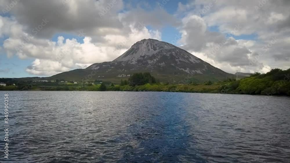 Aerial of Mount Errigal in Donegal, Ireland. Rising approach shot of mountain from the water. Aerial of Mount Errigal in Donegal, Ireland. Rising approach shot of mountain from the water.