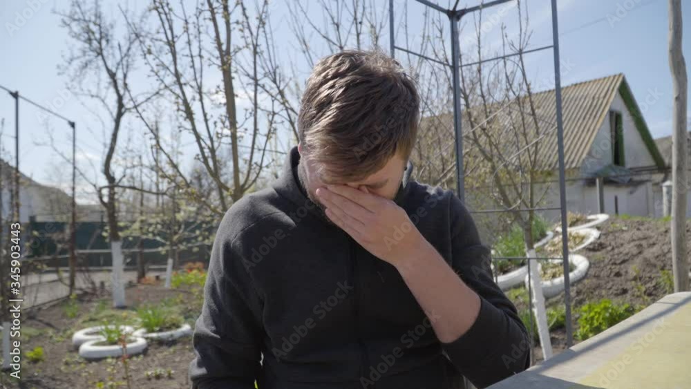 Portrait of ill Caucasian man sneezing and rubbing nose. Young brunette handsome guy agree with something looking at camera. Distant work, remote working, quarantine, lifestyle, business. Portrait of ill Caucasian man sneezing and rubbing nose. Young brunette handsome guy agree with something looking at camera. Distant work, remote working, quarantine, lifestyle, business.