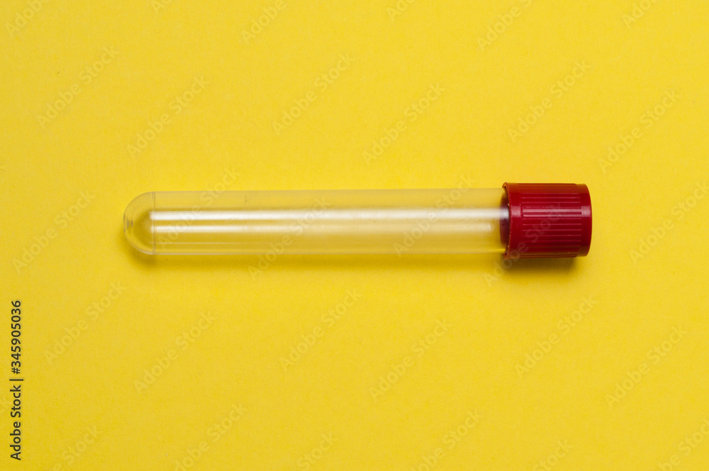 Naklejka premium One blood collection tube on a yellow background