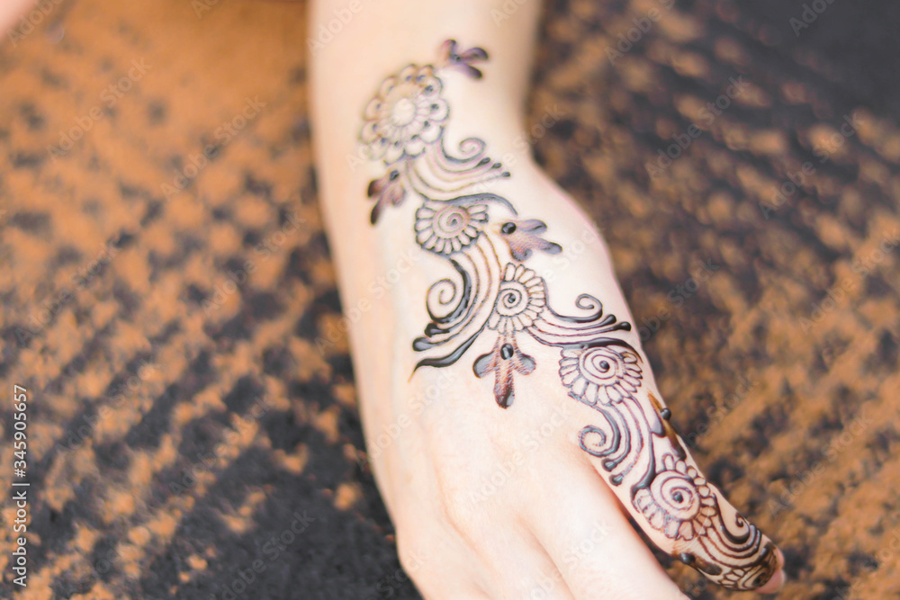 Simple mehndi design on hand