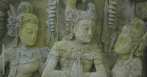Ancient Hindu Basorelief Sculptures Scene Facade in Bali Indonesia UHD 4k