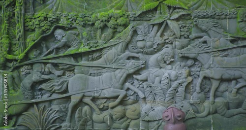 Wallpaper Mural Ancient Hindu Basorelief Sculptures Scene Facade in Bali Indonesia UHD 4k Torontodigital.ca