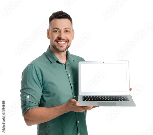 Handsome man with laptop on...