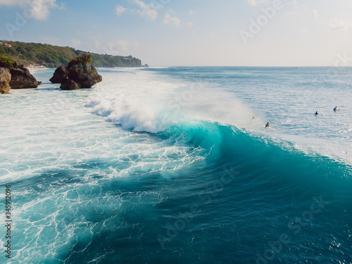 Surfing waves in ocean and shore. Aerial view of surf spot in Bali