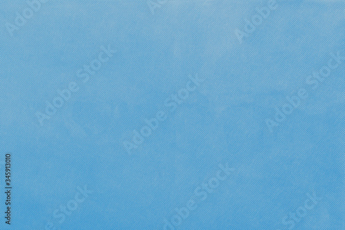 Blue non-woven fabric texture background. 