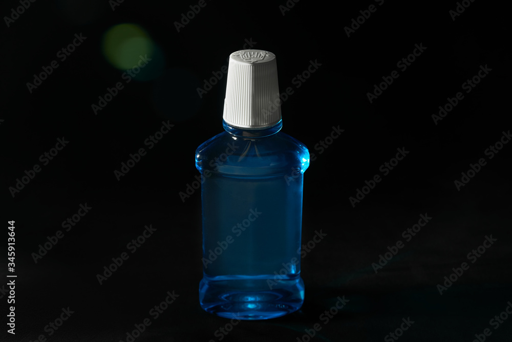 blue liquid. mouthwash. black background