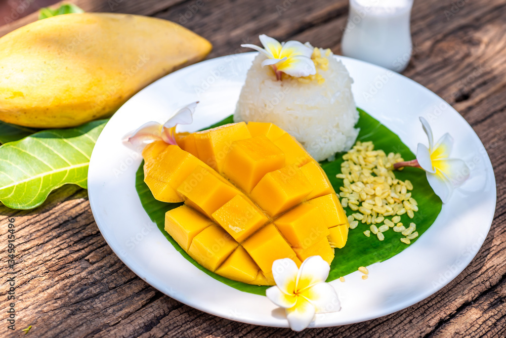 Thailand Dessert Sweet Mango And Sticky Rice On Banana Leaf, Summer fruit Thailand Dessert Sweet Mango And Sticky Rice On Banana Leaf, Summer fruit